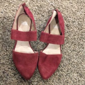Wine colored suede shoes.